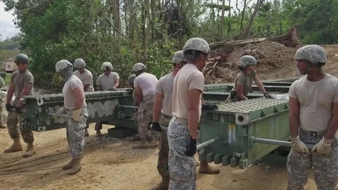 892nd Multi-Role Bridge Company off loading temporary bridge for Guajataca Dam Stock Footage 82066964