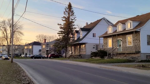 8K 24fps 4320p - Crisp sharp detailed 8K shot of houses and a road with driving Stock Footage 129787067