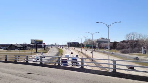 8K 24fps 4320p - Elevated view from overpass over the highway on bright clear Stock Footage 129785899