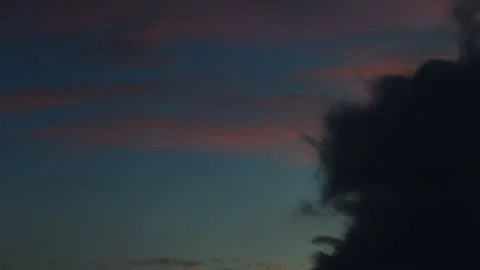 8K 59,94 fps Time-Lapse Twilight Sky with Fast-Moving Dark Cloud Stock Footage 321736440