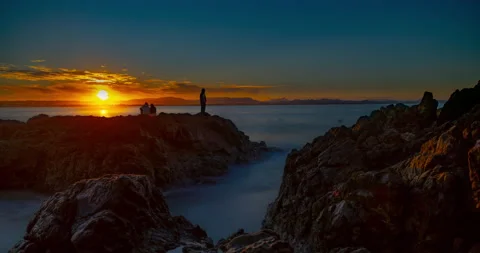 8K Beautiful Long Exposure Sunset Over Ocean &amp; Mountains Stock Footage 139028347