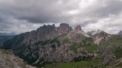 8K Dolomites Clouds rolling over the peaks of mountains Stock Footage 107978524