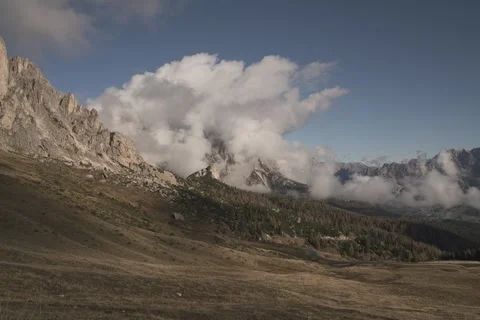 8K Dolomites spring clouds rolling over the mountains Stock Footage 256215306