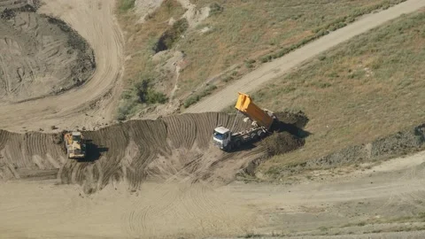 8K Dump Trucks Discharge Soil Stock Footage 169481571