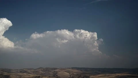 8K Fading Clearing Cumulus Clouds on Steppe Hills Stock Footage 164921806