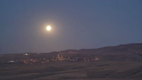 8K Full moon rising in cloudless night sky Stock Footage 171743035