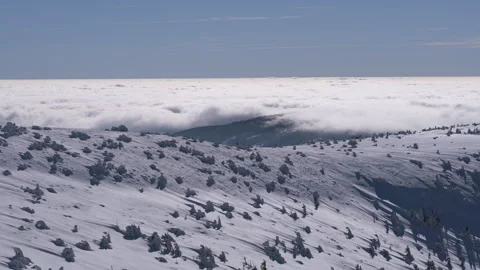 8K Low clouds rolling over the mountains and forest Stock Footage 255887395