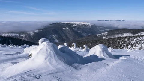 8K Low clouds rolling in the valley, winter and frozen landscape Stock Footage 108065341