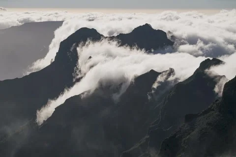 8K Madeira amazing clouds rolling over the peaks of mountains Stock Footage 241519061
