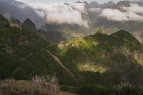 8K Madeira clouds rolling over the mountains into the valley Stock Footage 256244079