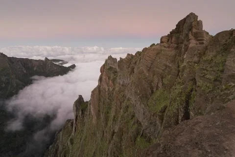 8K Madeira sunset colours over the mountain with fog rolling in the valley Stock Footage 241815441