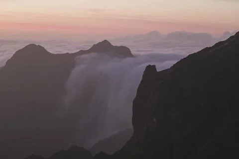 8K Madeira waterfall from clouds in sunset colours Stock Footage 256227238