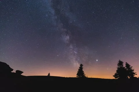 8K Milky way with rock and trees silhoue... | Stock Video | Pond5