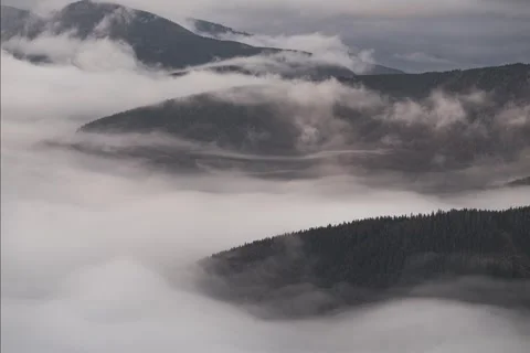8K Morning low clouds rolling over the hills Video stock 255912383