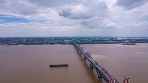 8K Moving time-lapse of flood season scenery at Jiujiang Yangtze River Bridg Video stock 339988930