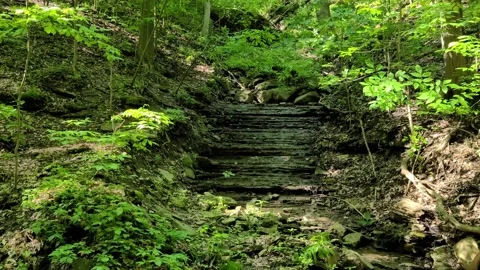 8K Natural staircase cascade with tiny bit of water in strange natural formation Video stock 135921387