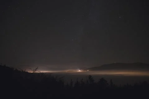 8K Night low clouds rolling over the city Stock Footage 255932197