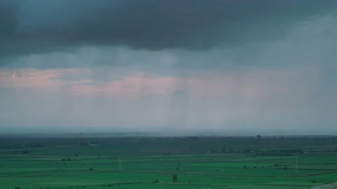 8K Rain on the flat plain covered with green fields Stock Footage 171728731