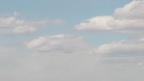 8K Resolution Soft White Clouds in Light Blue Sky Stock Footage 333680143