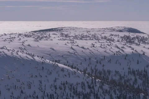 8K Sea of clouds rolling behind the frozen landscapes Stock Footage 255962266