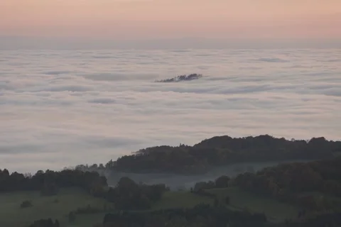 8K Small tree island in the low clouds Video stock 255935005