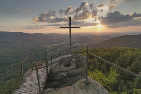 8K Sunset behind the mountain cross Stock Footage 255930094