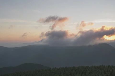 8K sunset clouds rolling over the hills Video stock 255932289
