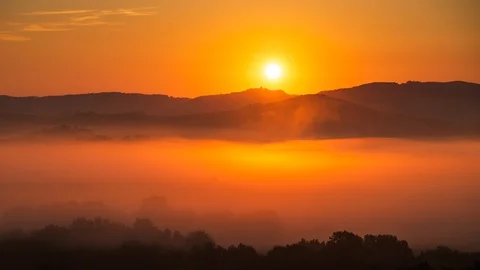 8K Time lapse of sunrise at misty morning, Tuscany, Italy Stock Footage