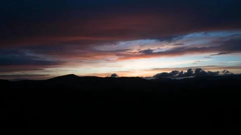 8K Time lapse sunset clouds swirling above the Plateau trees Nagano Japan Stock Footage 241964320