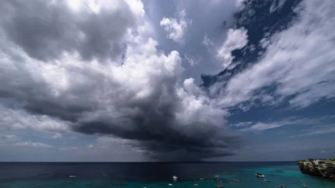 8k time lapse of thundershower scenery with flying clouds over the turquoise sea Stock Footage 162338807