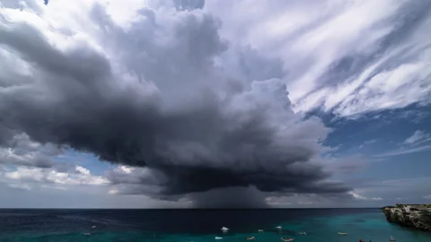 8k time lapse of thundershower scenery with flying clouds over the turquoise sea Stock Footage 162401548
