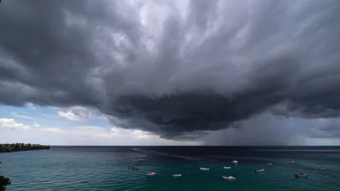 8k time lapse of thundershower scenery with flying clouds over the turquoise sea Stock Footage 162408867
