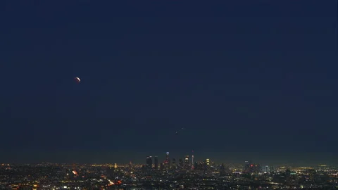 8K Time lapse of total lunar eclipse over Los Angeles skyline on May 15h, 2022 Stock Footage 194742339