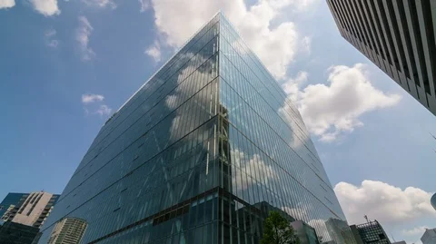 8K Timelapse of Cloudscape over Square Reflective Building in Tokyo Stock Footage