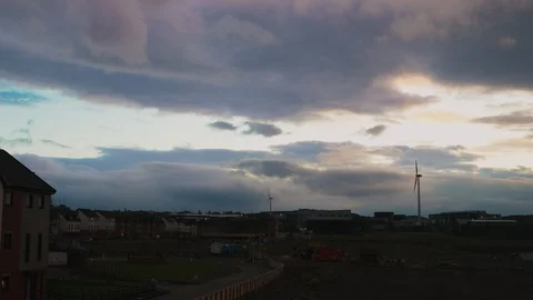 8K Timelapse of Dramatic Clouds In front of wind turbine - global warming Stock Footage 108619837
