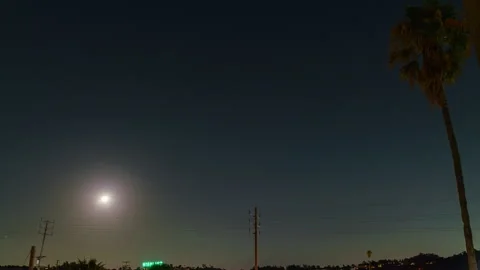 8K Timelapse of Harvest Moon partial lunar eclipse over Los Angeles, California Stock Footage 285075696