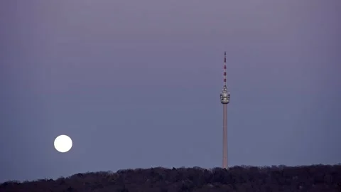 8K Timelapse moonrise over the Stuttgart TV tower on top of a hill Stock Footage