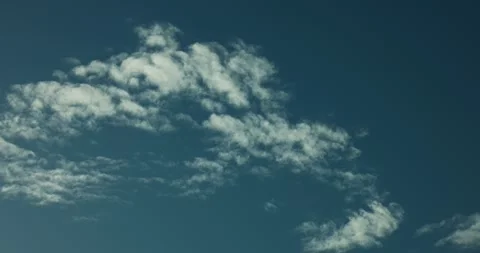 8K Timelapse of Serene White Clouds Dissipating in a Blue Sky Stock Footage 317820614