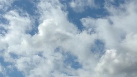 8K Ultra HD Cinematic Clouds Timelapse, Fluffy White Clouds on Blue Sky Stock Footage 332404324