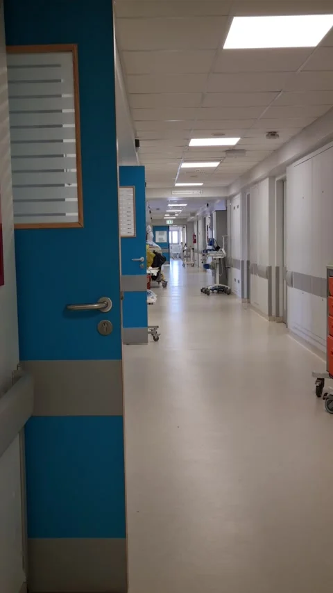 8K Ultra HD - Empty Hospital Corridor with Medical Equipment and Blue Doors Stock Footage 340501633