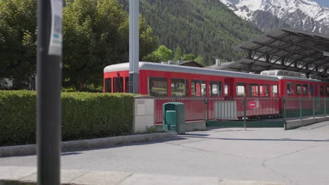 8K video red rack train montenvers train station in chamonix-mont-blanc valley Stock Footage 221596985