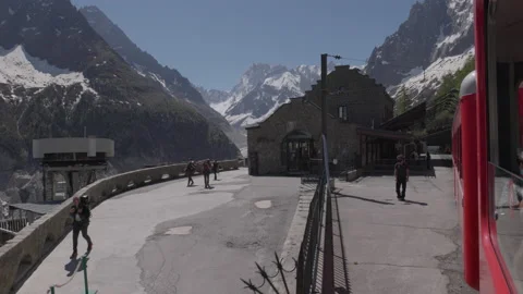 8K video red rack train montenvers train station in chamonix-mont-blanc valley Stock Footage 222013414
