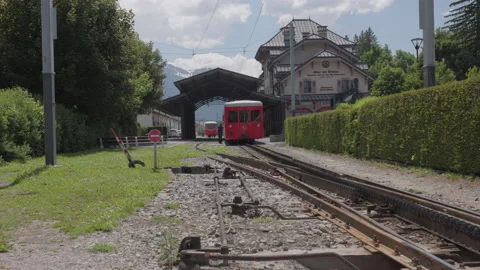 8K video red rack train montenvers train station in chamonix-mont-blanc valley Stock Footage 222019946