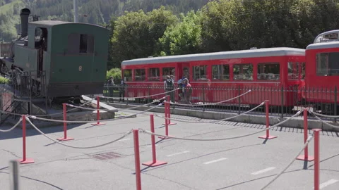 8K video red rack train montenvers train station in chamonix-mont-blanc valley Stock Footage 222022953