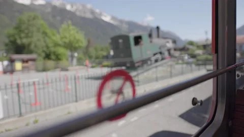 8K video red rack train montenvers train station in chamonix-mont-blanc valley Stock Footage 223332893