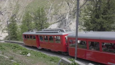 8K video red rack train montenvers going down in chamonix-mont-blanc valley Stock Footage 223333225