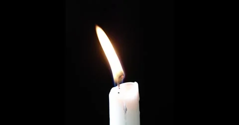 8k white candle flame flickering in the wind black backdrop timelapse melting Stock Footage 259224678