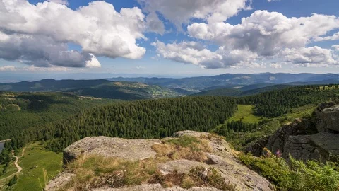 8k white clouds passing over forest hill landscape Stock Footage 121229681