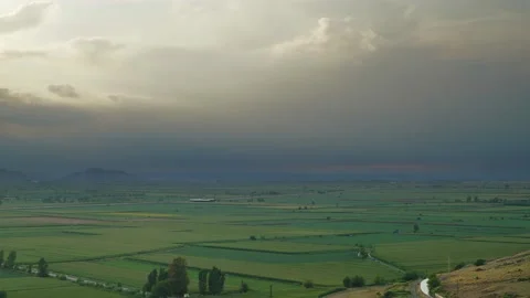 8K Wide Flat Plain Covered With Green Fields Stock Footage 170463716