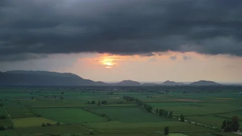 8K Wide Flat Plain Covered With Green Fields at Sunset Stock Footage 171741029